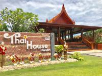 a house resort sign in front of a building at Thai House Resort in Hua Hin