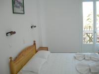 Postel nebo postele na pokoji v ubytování Bizas Rooms & Studios