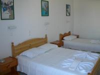 Postel nebo postele na pokoji v ubytování Bizas Rooms & Studios