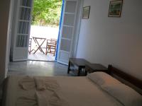 Postel nebo postele na pokoji v ubytování Bizas Rooms & Studios