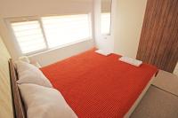 Postel nebo postele na pokoji v ubytování Lilly Apartments