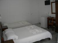 Postel nebo postele na pokoji v ubytování Bizas Rooms & Studios