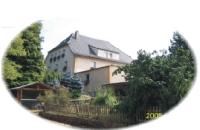 a reflection of a large house in a mirror at Pension zum Saale Blick in Bad Kissingen