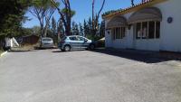 a car parked in front of a house at Xanadu Rural in Chiclana de la Frontera