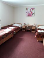 Łóżko lub łóżka w pokoju w obiekcie Hotel Paola