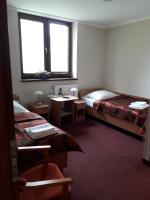 Łóżko lub łóżka w pokoju w obiekcie Hotel Paola