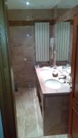 a bathroom with a sink and a large mirror at Hotel de l&#39;Orangerie in Strasbourg