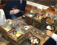 a group of people sitting around a table eating food at Lodge Scole in Zao Onsen