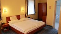 A bed or beds in a room at Hotel Josefa