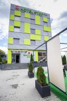 a hotel sign in front of a building at Stop Hotel in Braşov