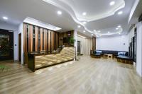 a lobby with a waiting room with a couch and tables at Kenting Coast Resort in Kenting