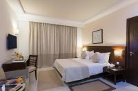 Postel nebo postele na pokoji v ubytování Le Corail Suites Hotel