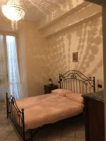Posteľ alebo postele v izbe v ubytovaní WHOLE HOLIDAY HOME APARTMENT SPLENDID CIVITAVECCHIA da Pamino & Priscilla