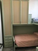 Posteľ alebo postele v izbe v ubytovaní WHOLE HOLIDAY HOME APARTMENT SPLENDID CIVITAVECCHIA da Pamino & Priscilla