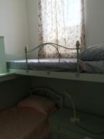 Posteľ alebo postele v izbe v ubytovaní WHOLE HOLIDAY HOME APARTMENT SPLENDID CIVITAVECCHIA da Pamino & Priscilla
