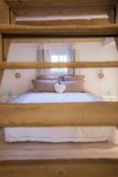 a bedroom with a bed with a heart on it at La Grange aux Coqs in Ittenheim