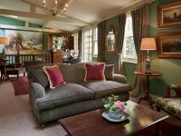 a living room with a couch and a table at The Rookery in London