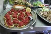 a plate of food on a table with plates of food at Albergo Boule de Neige in Rhêmes-Notre-Dame