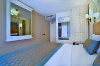 Postel nebo postele na pokoji v ubytování Beethoven Hotel & Suite