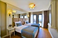 Postel nebo postele na pokoji v ubytování Beethoven Hotel & Suite