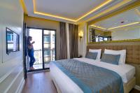 Postel nebo postele na pokoji v ubytování Beethoven Hotel & Suite