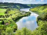 an aerial view of a river in a valley at Camping Bissen in Esch-sur-Sûre