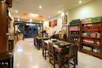 a restaurant with tables and chairs in a store at Lakeview Homestay in Yuchi