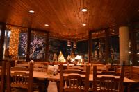 a dining room with a table and chairs at Lodge Scole in Zao Onsen