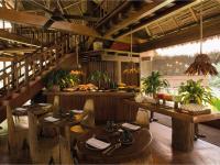 a restaurant with wooden tables and chairs and a counter at Inkaterra Reserva Amazonica in Puerto Maldonado