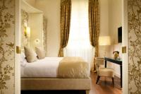 Posteľ alebo postele v izbe v ubytovaní San Firenze Suites & Spa