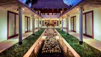 a banquet hall with tables in the middle of a building at Qunci Villas Resort in Senggigi