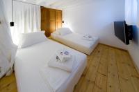 A bed or beds in a room at Villa Myrto