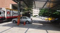 a group of cars parked in a parking lot at Sanduo Hotel in Kaohsiung