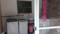 a room with a refrigerator and a window and a door at Sanduo Hotel in Kaohsiung