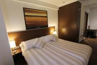 A bed or beds in a room at Pensión Grosen