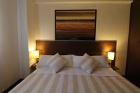 A bed or beds in a room at Pensión Grosen