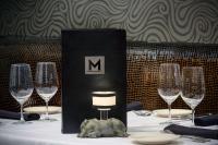 a table with wine glasses and a black box on it at Hyatt Regency Bethesda near Washington D.C. in Bethesda