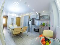 A kitchen or kitchenette at Camp Nou, Europa Fira - modern two-bedroom apartment with heating