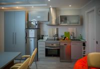 A kitchen or kitchenette at Camp Nou, Europa Fira - modern two-bedroom apartment with heating