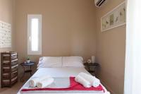 Postel nebo postele na pokoji v ubytování Aegina Villa Kalliopi