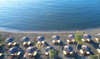 an overhead view of a beach with chairs and the ocean at Four Seasons Hotel in Limassol