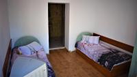 A bed or beds in a room at Hotel Bilyana