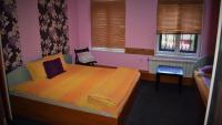 A bed or beds in a room at Hotel Bilyana
