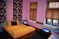 A bed or beds in a room at Hotel Bilyana