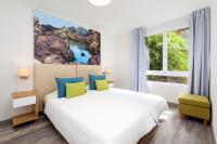 Postel nebo postele na pokoji v ubytování Apartamentos Tigaiga Suites