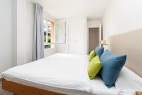 Postel nebo postele na pokoji v ubytování Apartamentos Tigaiga Suites
