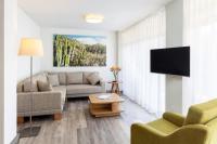 TV a/nebo společenská místnost v ubytování Apartamentos Tigaiga Suites