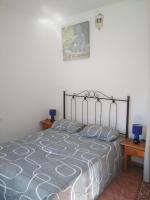 Łóżko lub łóżka w pokoju w obiekcie Goyo Gomera Apartments