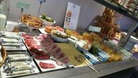 a buffet with meats and fruit on a table at Best Western Hotel de la Breche in Niort