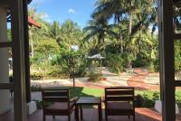 a view of a garden from the porch of a resort at Peppercorn Beach Resort in Phú Quốc